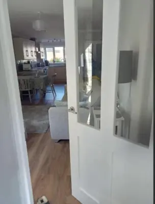 a open door to a room with a living room at 2 Bedroom Garden Flat in Halesworth