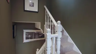 a staircase with white railings in a home at Colchester Luxury Apartments - Colonia in Colchester