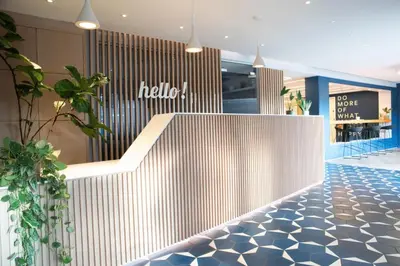 a lobby of a store with a white wall at For Students Only - Student Castle Cambridge in Cambridge