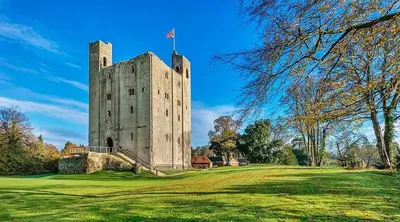 a castle with a flag on top of it at Beautiful Cottage opposite Hedingham Castle! in Castle Hedingham