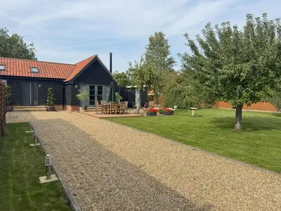 a house with a gravel driveway next to a yard at 1 Bed in Dickleburgh oc-m33974 in Dickleburgh