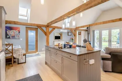 a kitchen with a large island in the middle of a room at 1 Bed in Dickleburgh oc-m33974 in Dickleburgh