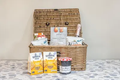 a basket with food and other items on a table at 1 Bed in Dickleburgh oc-m33974 in Dickleburgh