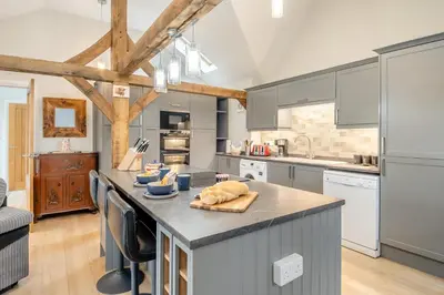 a kitchen with gray cabinets and a counter top at 1 Bed in Dickleburgh oc-m33974 in Dickleburgh