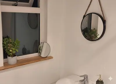 a bathroom with a mirror and a sink at Modern 4BR Cambridge House with Parking for 9 guests in Cambridge