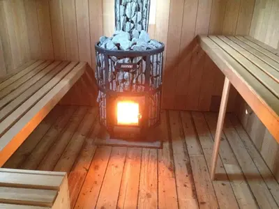 a lantern in the middle of a room in a sauna at The Manor Dairy in Sandy