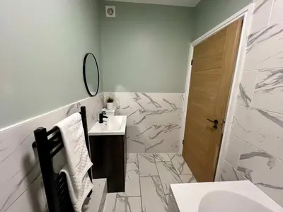 a bathroom with a sink and a mirror at 3 The Royal Serviced Apartments, Harwich -Ground Floor-Parking -Wifi in Parkeston