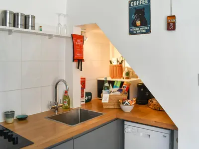 a kitchen with a sink and a counter top at Flock Cottage in Eye