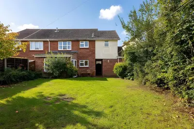 a brick house with a lawn in front of it at Surehaven Stays 6 Bedroom House Great for Teams in Colchester