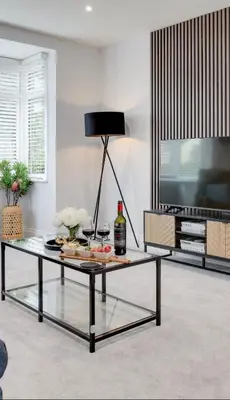 a living room with a coffee table and a tv at Surehaven Stays 3 Bedroom House Braintree in Braintree