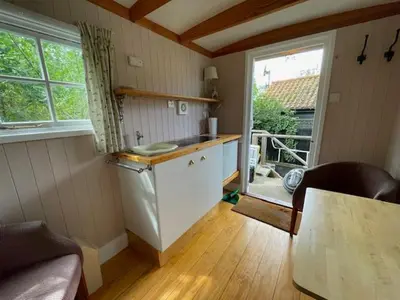 a small kitchen with a counter and a window at Riverside Retreat in Little Baddow