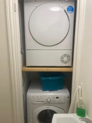 a washer and dryer in a small room at Cassandra Homes in Nevendon