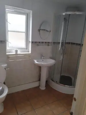 a bathroom with a sink and a shower at APEX HOUSE Le Hope ENSUITE in Horndon on the Hill