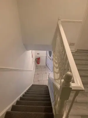 a staircase in a house with a stair case at APEX HOUSE Le Hope ENSUITE in Horndon on the Hill