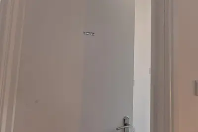 a door with a sign on it in a room at 2 Bedroom Flat in the heart of Southend Sleeps 6 - Pass the Keys in Southend-on-Sea