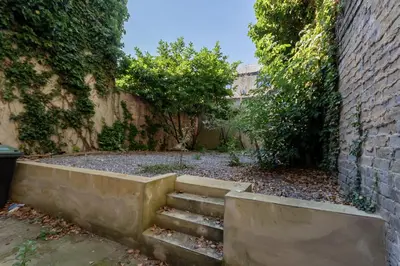 a set of stairs next to a brick wall at 2 Bedroom Flat in the heart of Southend Sleeps 6 - Pass the Keys in Southend-on-Sea