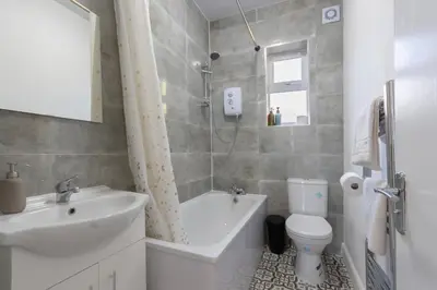 a bathroom with a sink and a toilet and a shower at 2 Bedroom Flat in the heart of Southend Sleeps 6 - Pass the Keys in Southend-on-Sea