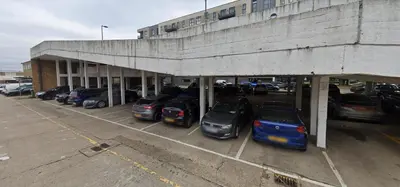 a bunch of cars parked in a parking lot at Harlow Flat - Perfect for Families or Contractors in Harlow