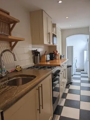 a kitchen with a sink and a stove at Beautiful apartment in central Cambridge in Cambridge