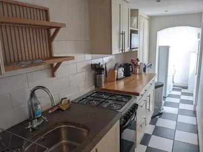 a kitchen with a sink and a stove at Beautiful apartment in central Cambridge in Cambridge