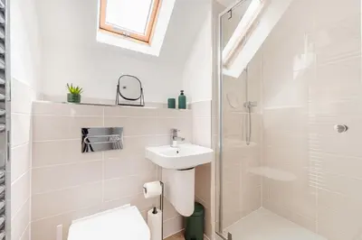 a white bathroom with a toilet and a sink at 4 Bed, 3 Bath Townhouse in Colchester - Business, Contractor and Leisure - Singles or Superkings - Disc0unts in Lexden