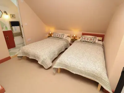 two beds in a small room with at 52 Lee Road in Aldeburgh