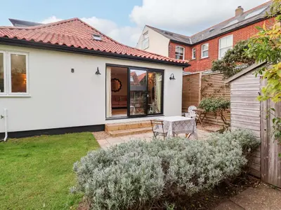 a house with a patio and a garden at 52 Lee Road in Aldeburgh