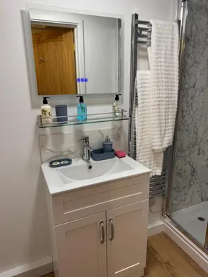 a bathroom with a sink and a shower at Poets View - Studio in Honington, Suffolk in Honington