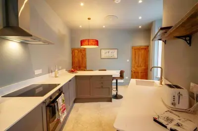 a kitchen with a sink and a counter top at 3 bed Victorian terrace 10mins walk from Colchester city centre in Colchester