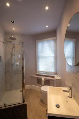 a bathroom with a shower and a sink and a toilet at 3 bed Victorian terrace 10mins walk from Colchester city centre in Colchester