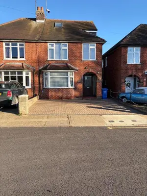 a brick house with a parking lot in front of it at City Centre, En-Suite, 3 Doubles 1 Single, 2 Car Parking in Colchester