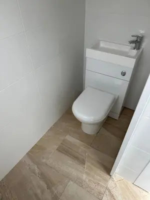 a white bathroom with a toilet and a sink at City Centre, En-Suite, 3 Doubles 1 Single, 2 Car Parking in Colchester