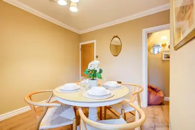 a dining room with a table and chairs at Cottage in the centre in Colchester