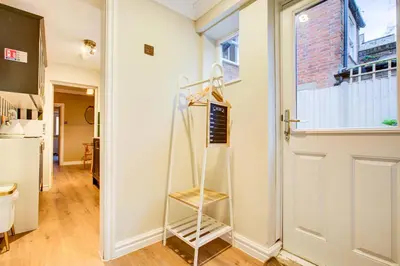 a room with a ladder next to a door at Cottage in the centre in Colchester