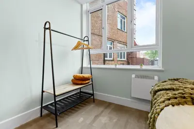 a bedroom with a bed and a window at Modern, Quiet & Cozy Flat in Central Chelmsford - F7 in Chelmsford