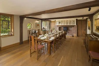 a dining room with a long table and chairs at Martley Hall Estate by Group Retreats in Woodbridge