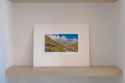 a picture on a shelf in a white wall at Cambridge Charming 2 Bedroom Home I Rustic Floors & Office I Parking in Milton