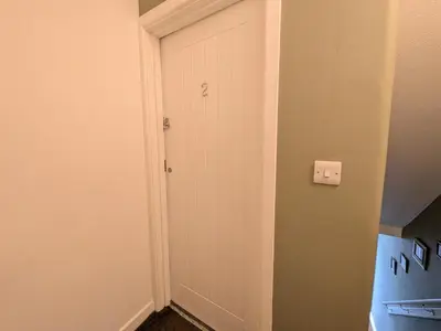 a door with the number two on it in a room at Digby house flat 2 in West Mersea