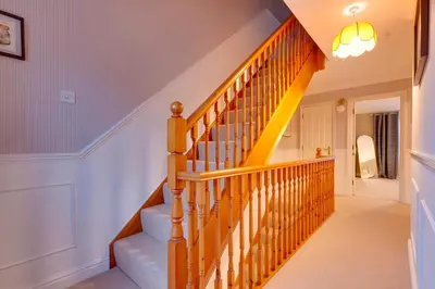 a winding staircase in a home with white walls at Stylish Modern Home in City Centre Free Parking - Pass the Keys in Cambridge