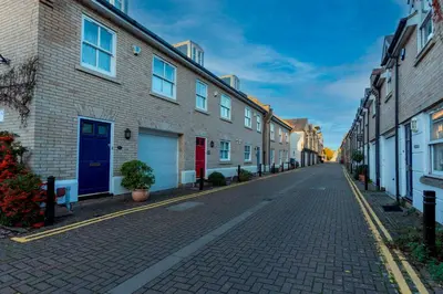 an empty street with houses on each side at Stylish Modern Home in City Centre Free Parking - Pass the Keys in Cambridge