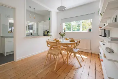 a kitchen and dining room with a table and chairs at Central Victorian Villa 2 Floor I Parking I Garden in Cambridge