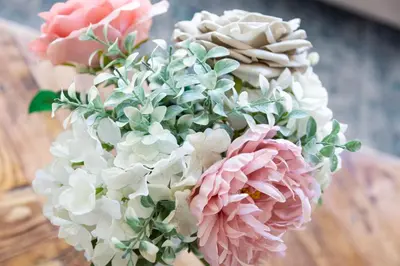a bouquet of pink and white flowers on a table at 5 Bed Seaside Property with Garden , Parking and Games Room in Southend-on-Sea