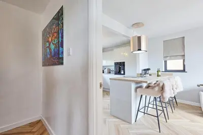 a kitchen with a counter and a sink in a room at Luxury Apartment- Beach 10mins in Thorpe Bay