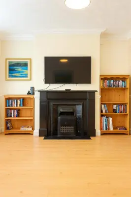 a living room with a fireplace with a flat screen tv at 1 Bed Service Accommodation- contractor ready in Southend-on-Sea
