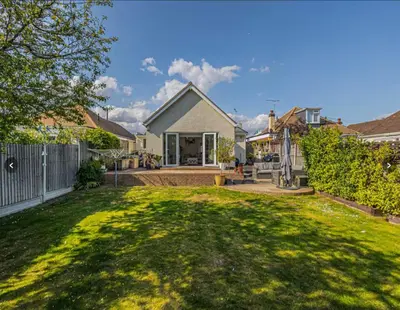 a house with a large yard with a fence at Stunning home in Leigh Sleeps 5 - Pass the Keys in Southend-on-Sea