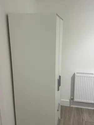 an open door in a room with a radiator at Systematic Home in Battlesbridge