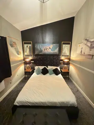 a bedroom with a large bed with two night stands at The Olive Stay by Cambridge City Centre in Chesterton