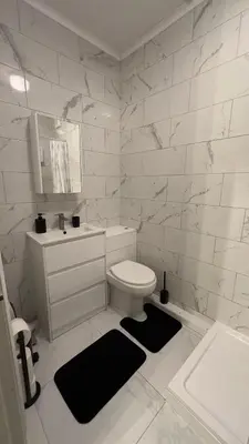 a white bathroom with a toilet and a sink at The Olive Stay by Cambridge City Centre in Chesterton
