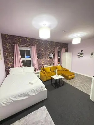 a bedroom with a bed and a living room at The Lavender Stay by Cambridge City Centre in Chesterton