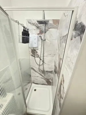 a shower with a glass enclosure in a bathroom at The Lavender Stay by Cambridge City Centre in Chesterton